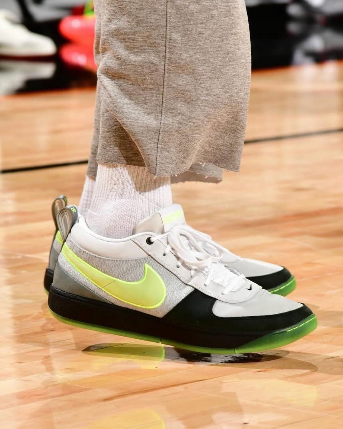 Nike Book 1 Neon Air Max 95-inspired sneaker on-foot close-up. Nike Book 1 Neon Air Max 95-inspired sneaker on-foot close-up.