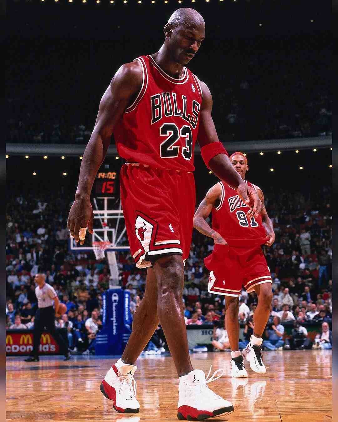 Michael Jordan wearing the OG Air Jordan 13 White True Red colorway during a Chicago Bulls away NBA game. Michael Jordan wearing the OG Air Jordan 13 White True Red colorway during a Chicago Bulls away NBA game.